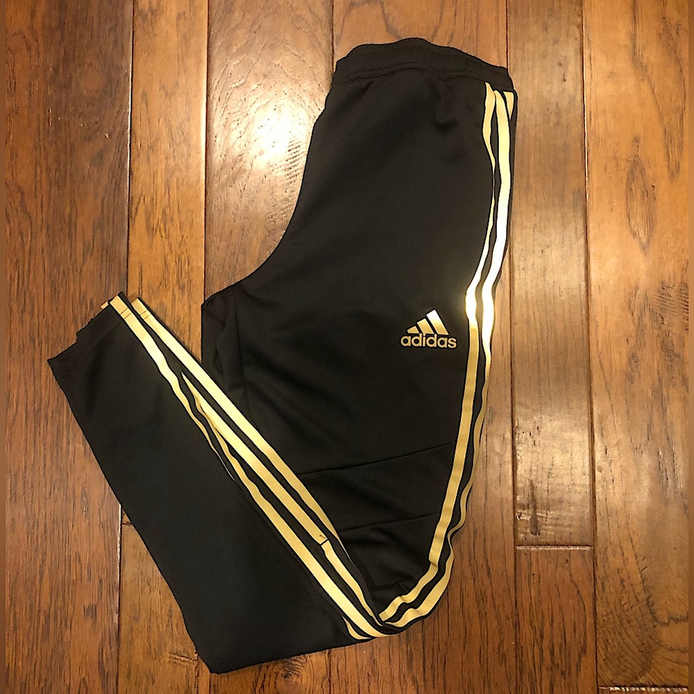 Mens (S) black adidas joggers with gold stripes, tapered leg with zippers.